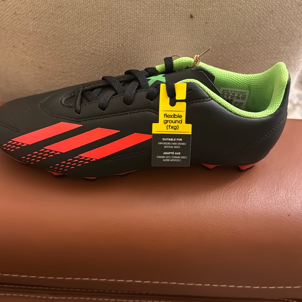 Adidas. Speedportal 4 soccer cleats. Youth size 4.5. Brand new never worn.